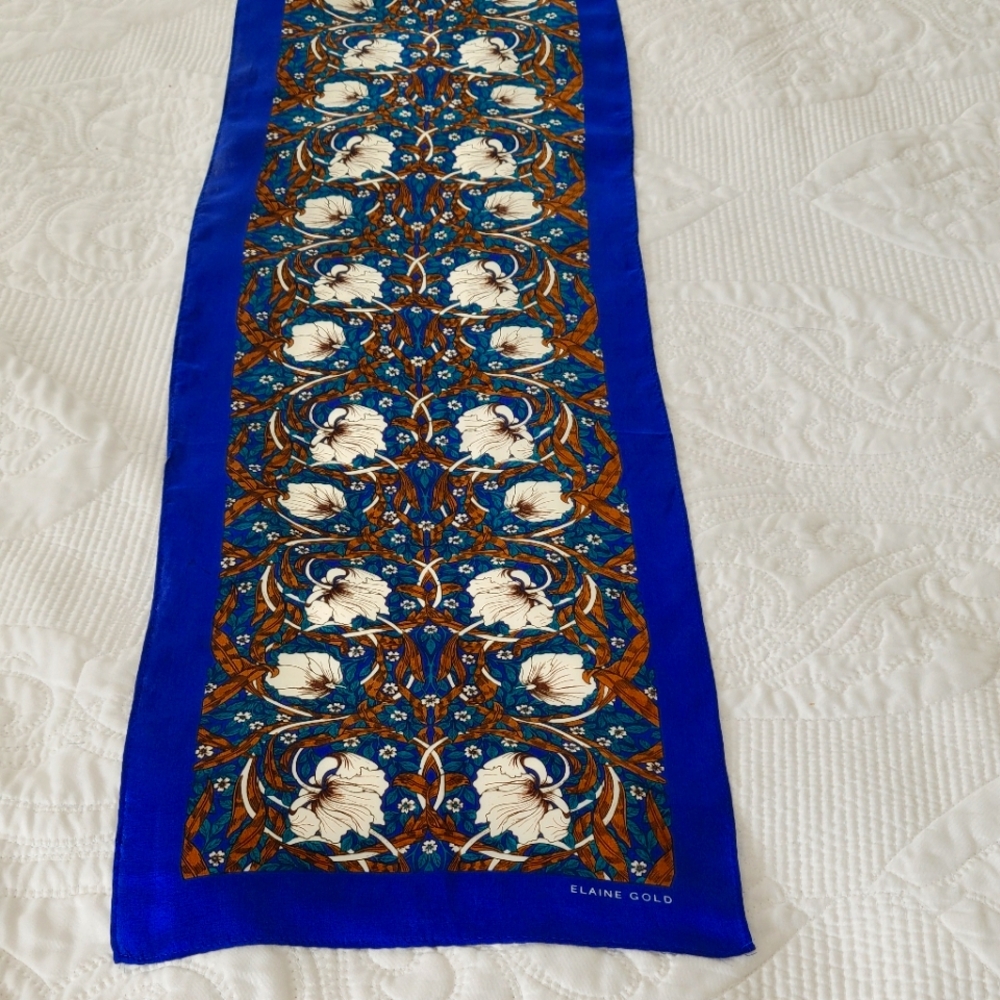 GORGEOUS SILK SCARF BY ELAINE GOLD ,HAND ROLLED EDGES. 52X10 INCHES LONG.